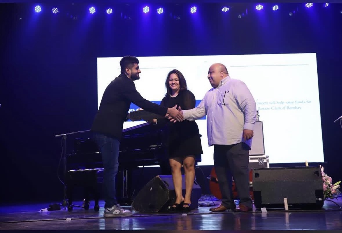 Amey Sharma being felicitated on stage at the Igor Butman concert